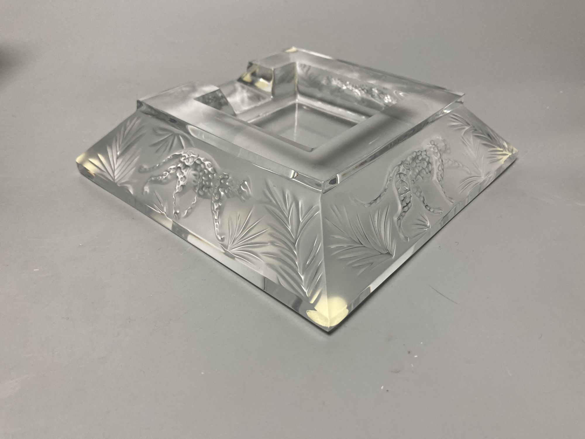A Lalique R. France frosted glass 'leopard' ashtray, 16.5cm sq.